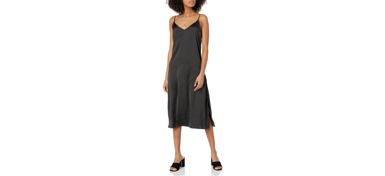 Woman wearing The Drop Ana Silky Midi Slip Dress on white background Woman wearing The Drop Ana Silky Midi Slip Dress on white background