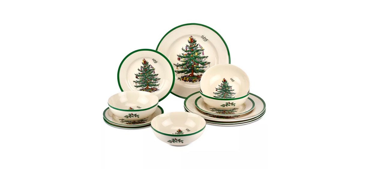 Beige plates and bowls with green borders and images of green Christmas trees on them