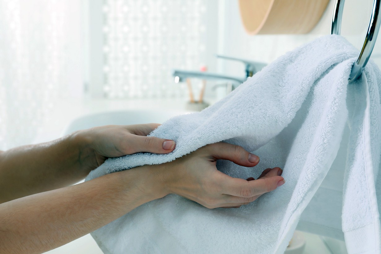 hands drying on towel