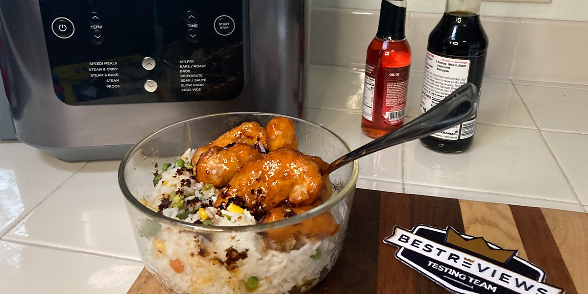 Ninja Speedi on countertop with bowl of chicken and rice Ninja Speedi on countertop with bowl of chicken and rice