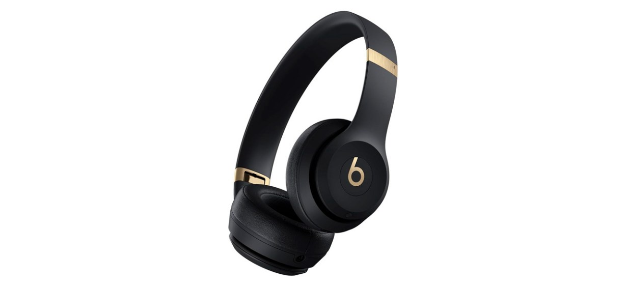Beats Solo 4 wireless headphones in black with gold accents