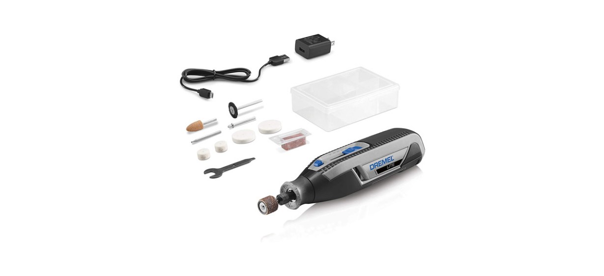 A cordless Dremel rotary tool with accessories next to it