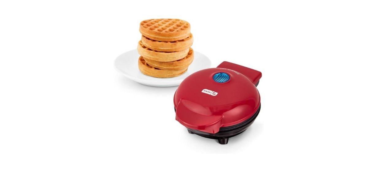 Dash Mini Waffle Maker next to a plate of waffles
