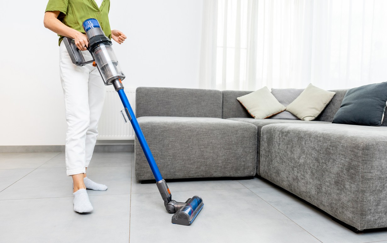 Women with Cordless Vacuum Cleaner